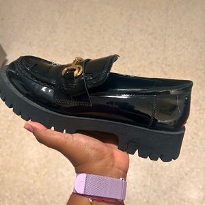 Black loafers with gold.